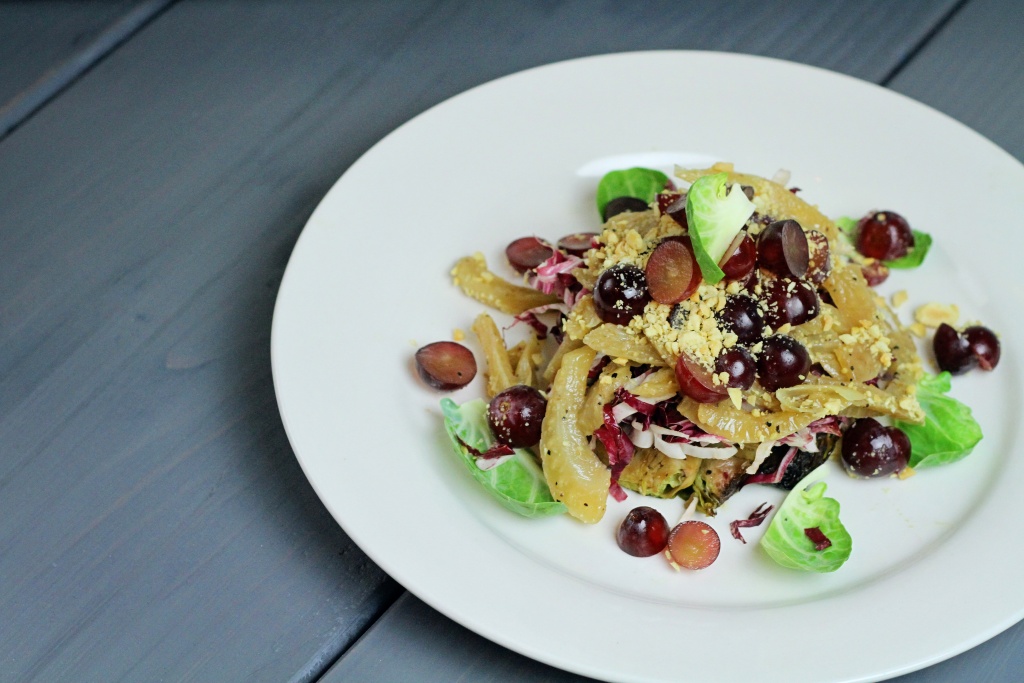 Roasted brussel sprout salad with caramelized fennel, marcona almonds and fresh red grapes